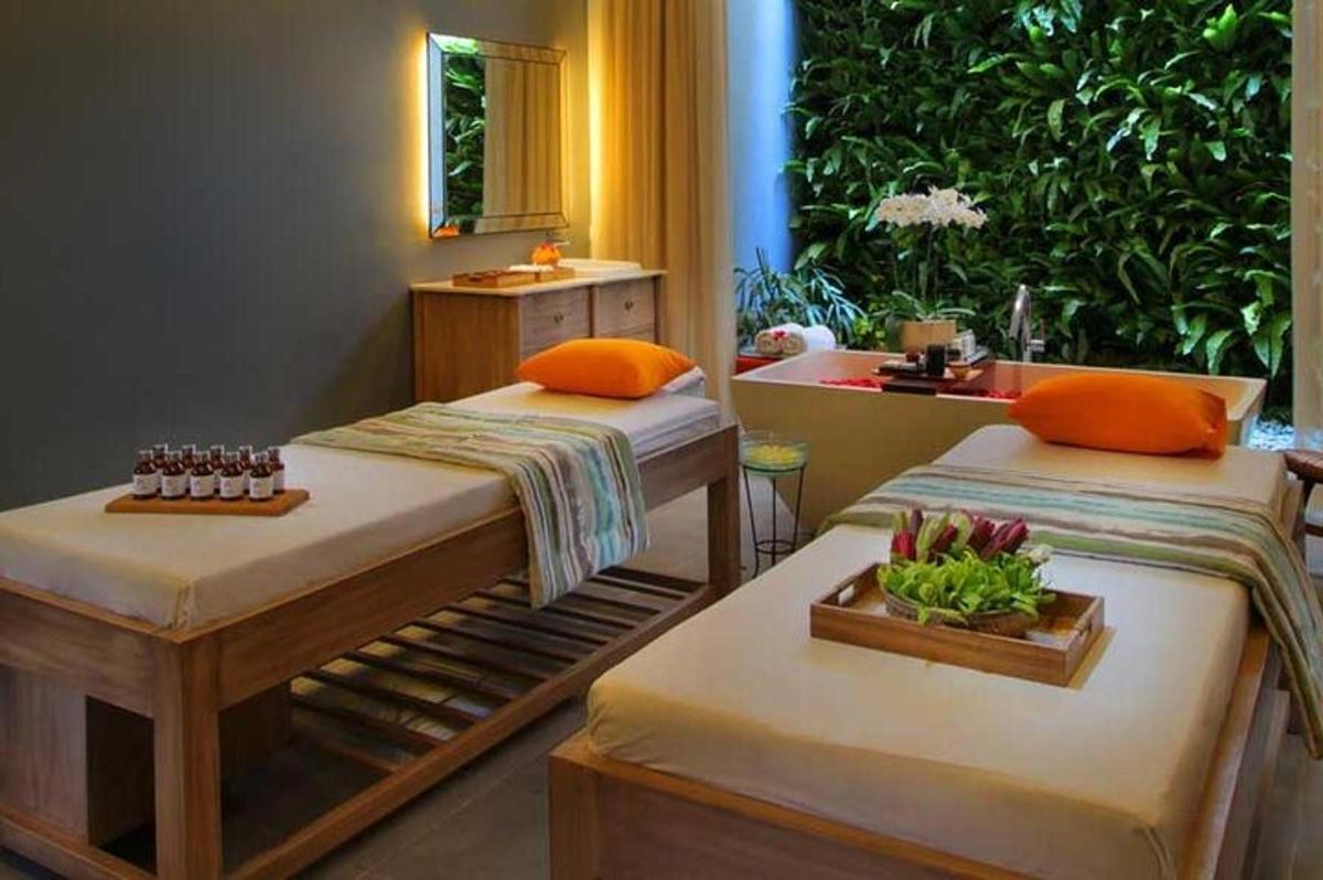 two beds in a room with a bathroom