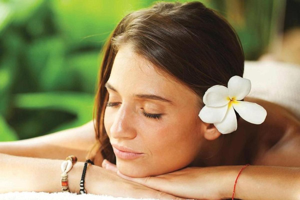 a young woman with a flower in her hair