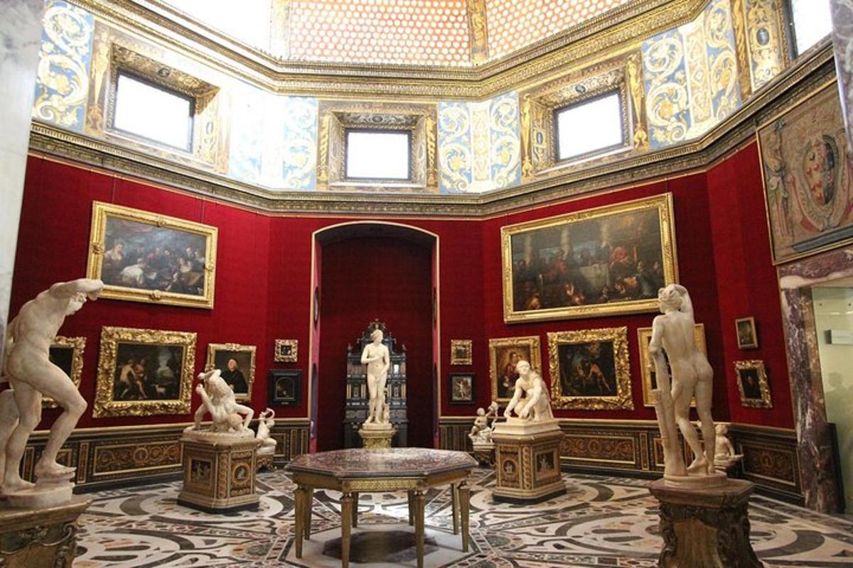 a room with statues and paintings on the walls
