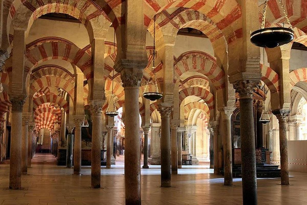 a large room with columns and arches in a building