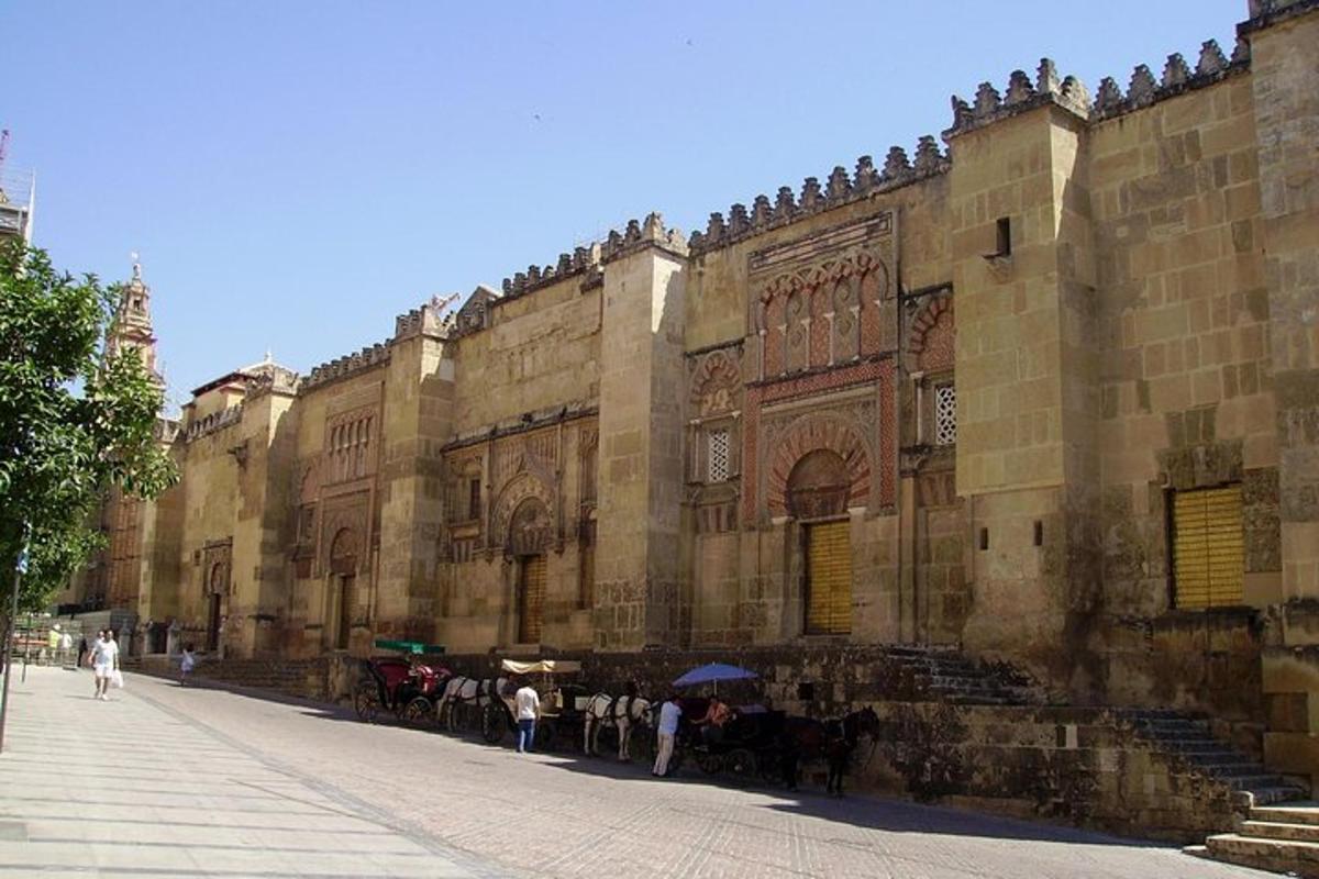 a large building with people standing outside of it
