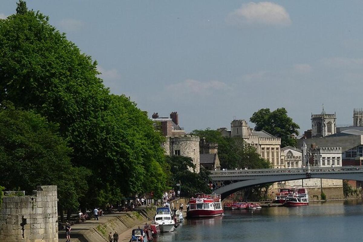 a bridge over a river in a city with boats