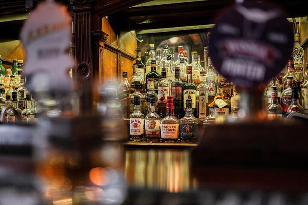 a bar with a lot of bottles of alcohol