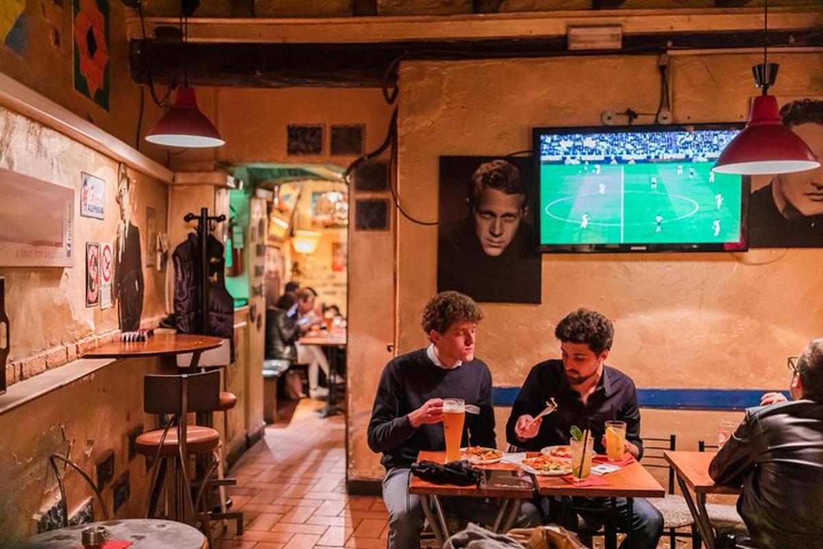 two men sitting at a table in a restaurant