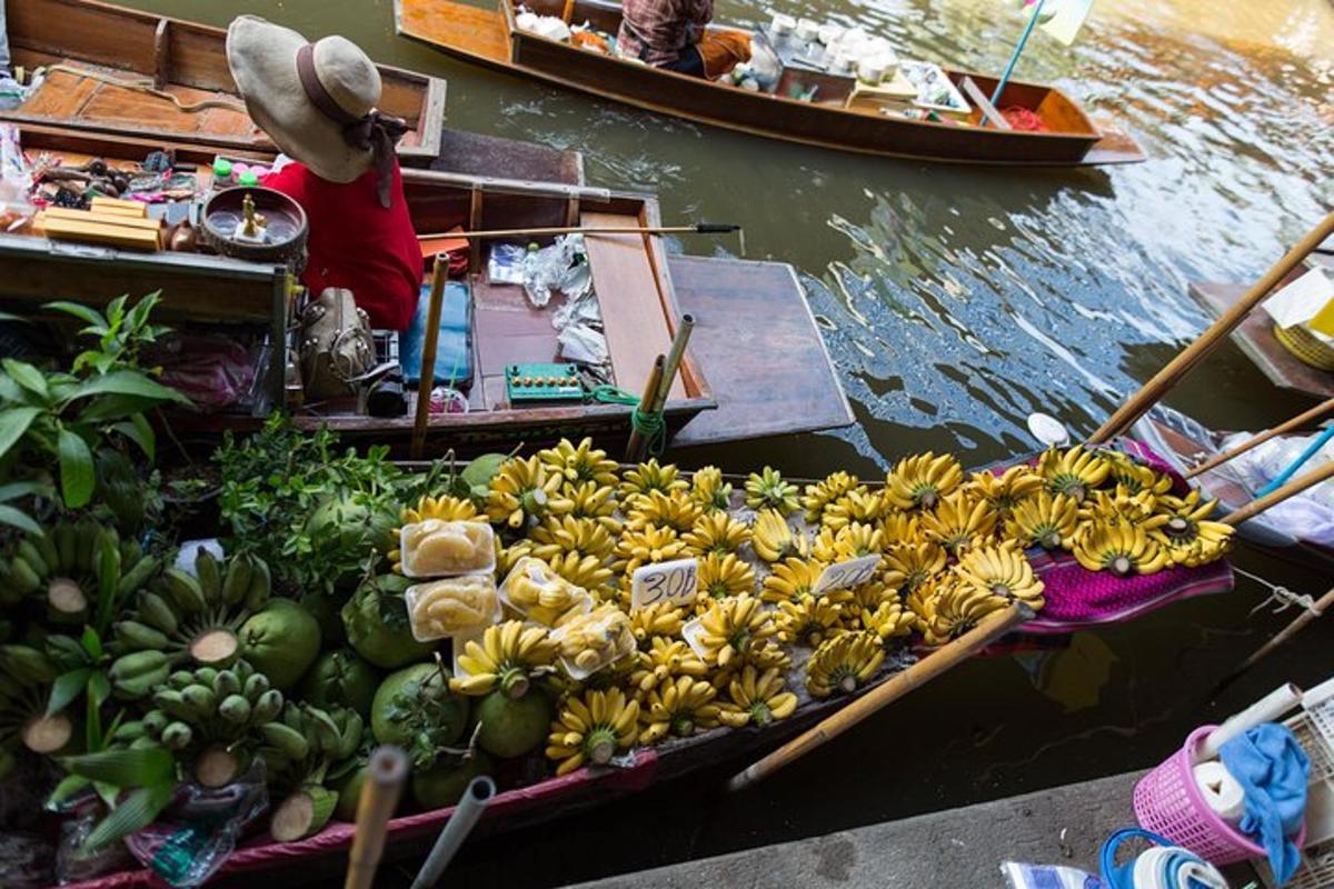 a bunch of bananas and other fruits on a boat