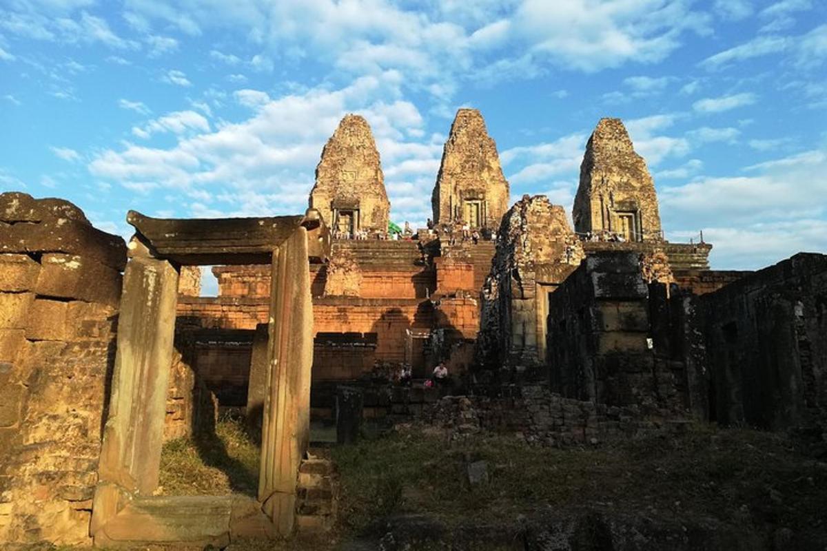 a group of stone buildings with a sky background
