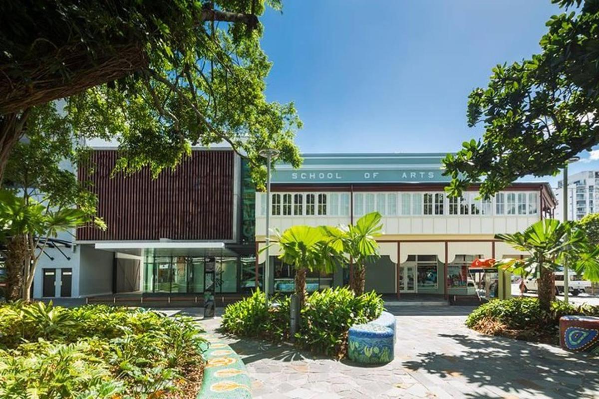 a large building with trees in front of it