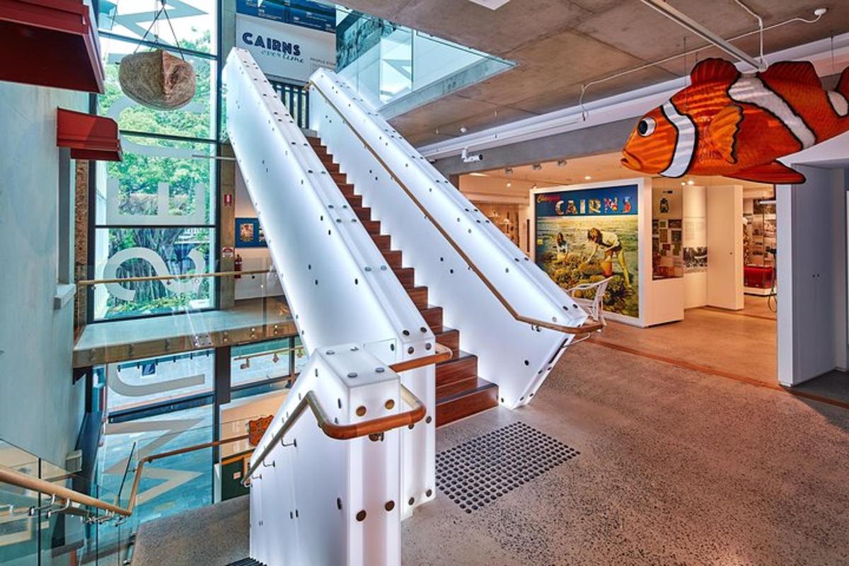 a set of stairs in a building with a aquarium