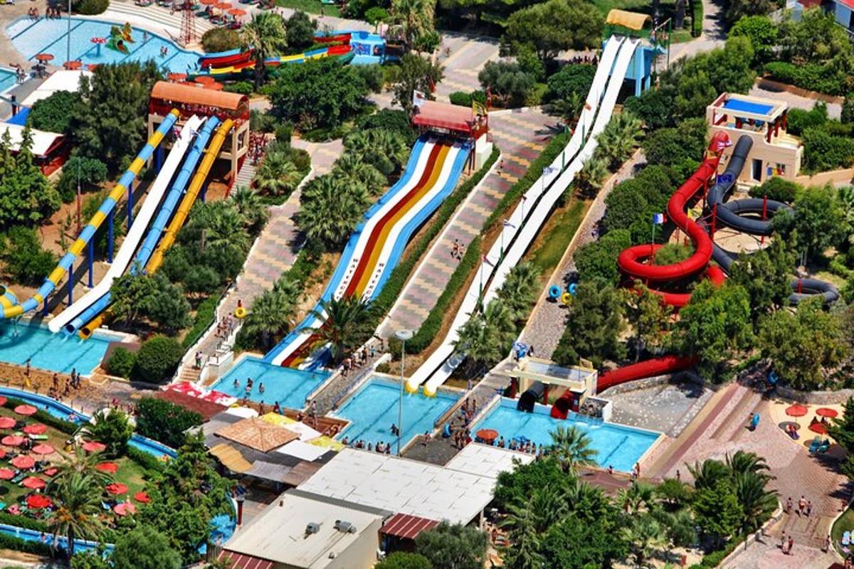 an aerial view of a water park with a roller coaster