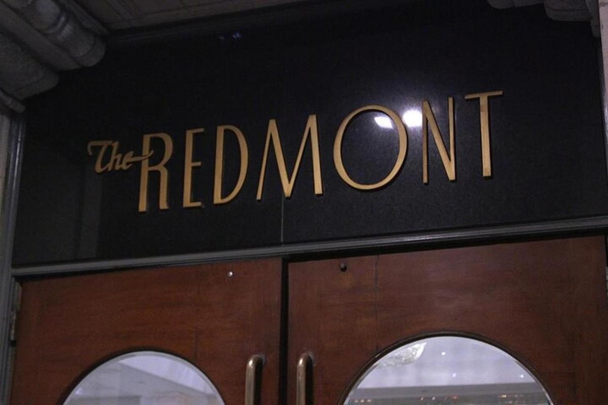 a sign that reads the red room on top of a door