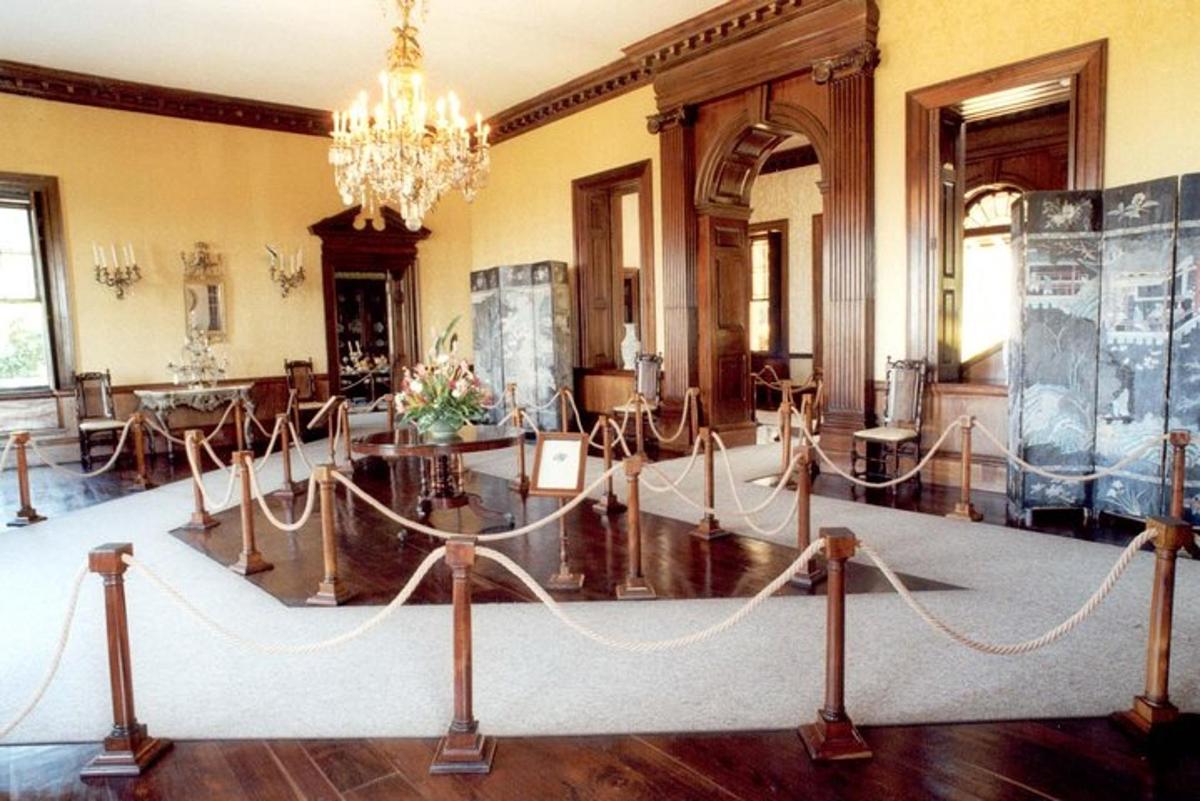 a room with a table and a chandelier