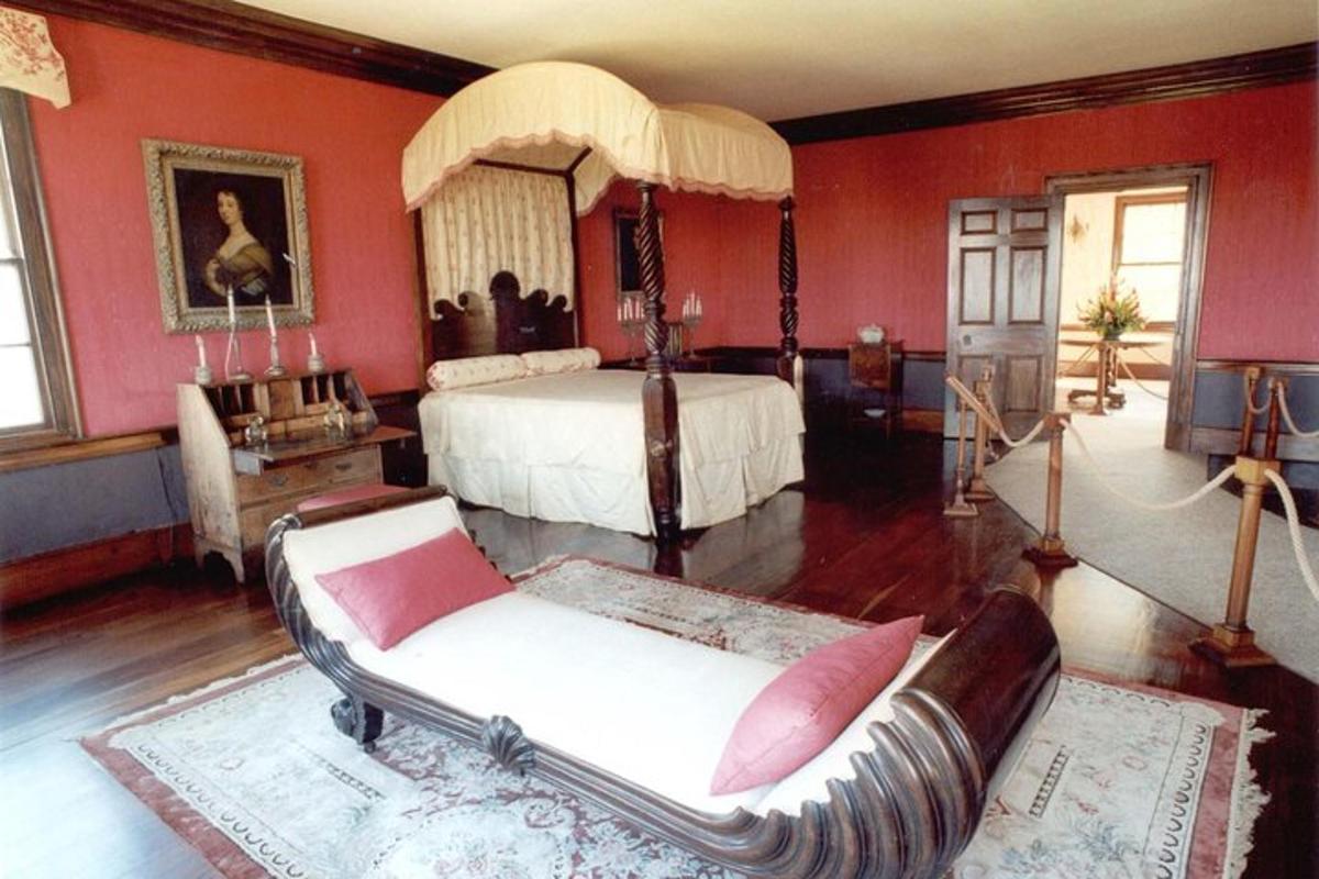 a bedroom with a bed and a couch in it