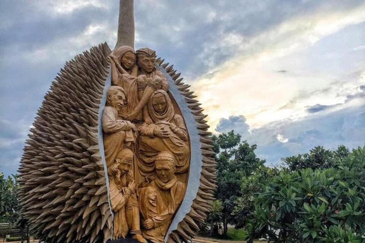 a statue of a group of people on a boat