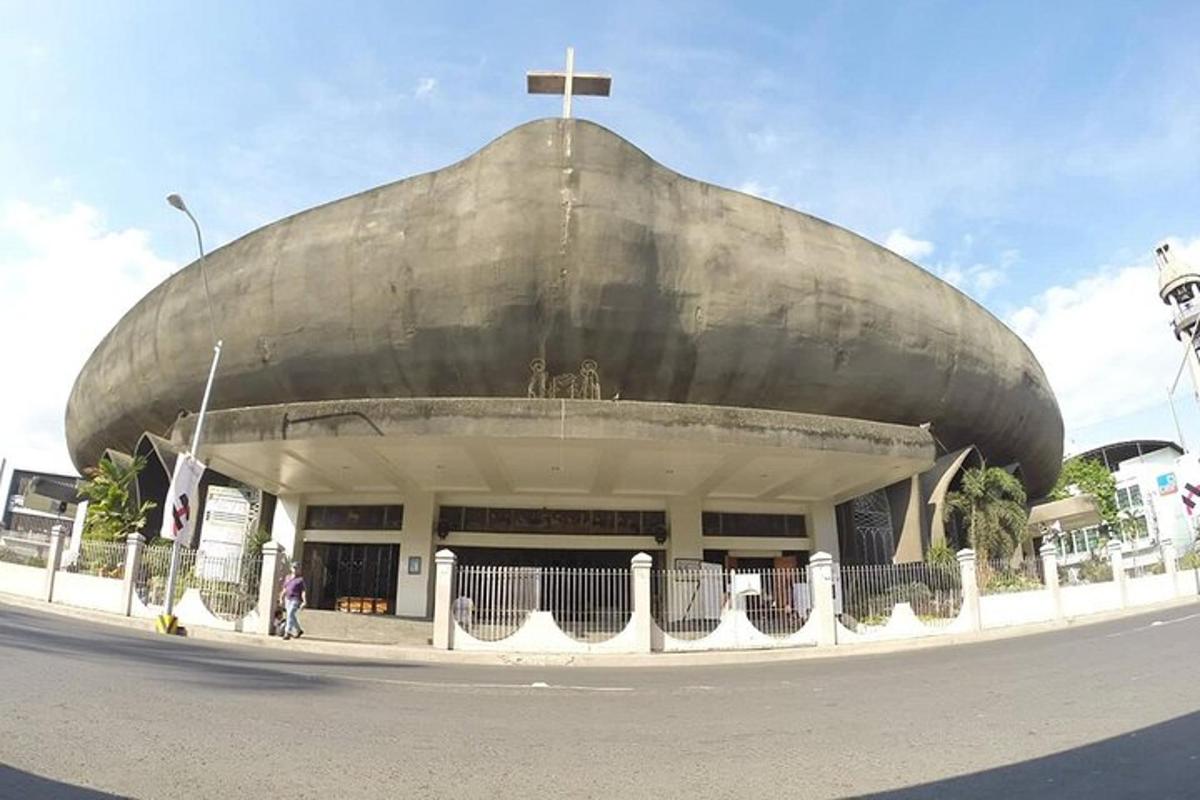 a large building with a cross on top of it