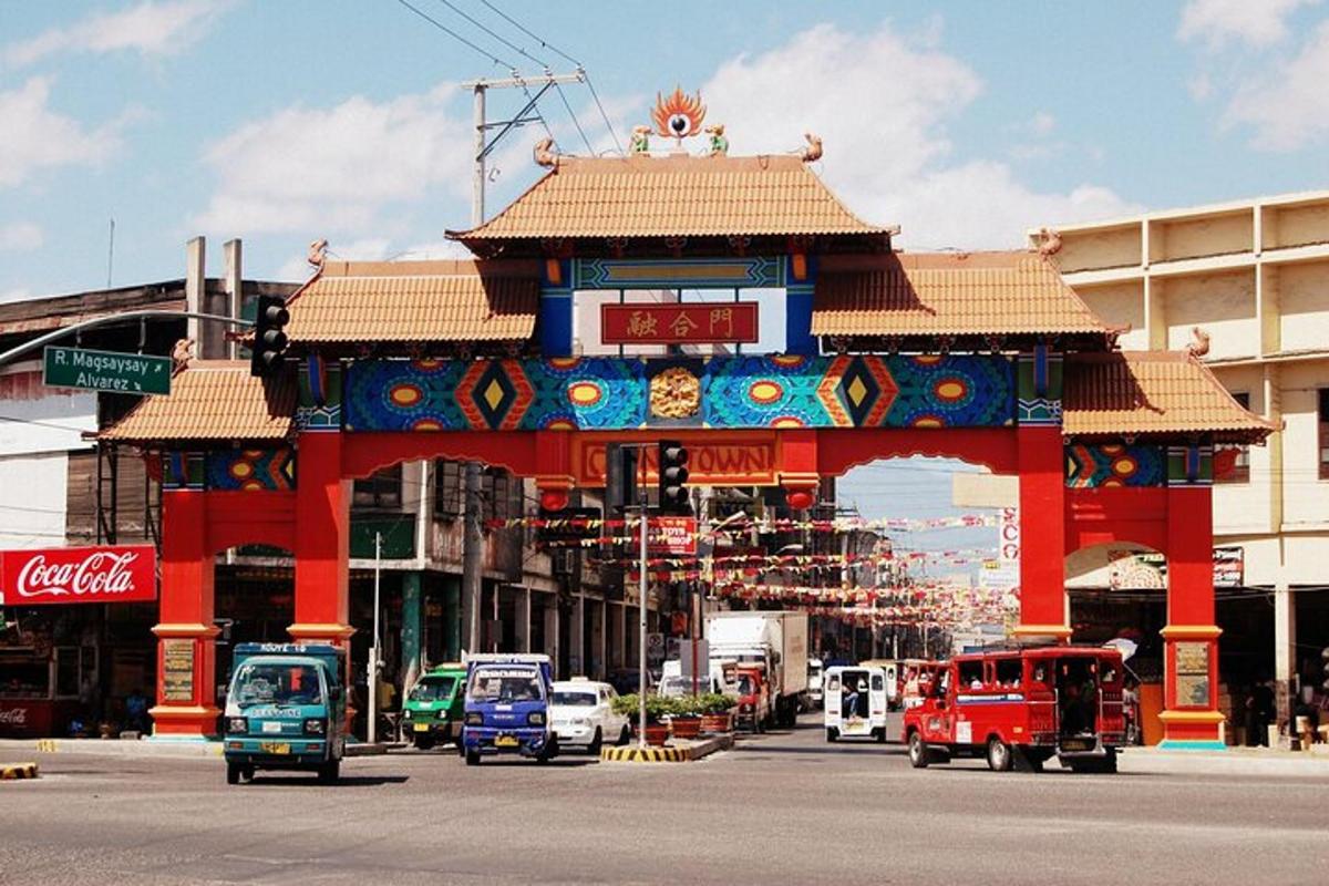 a building with a gate in the middle of a street