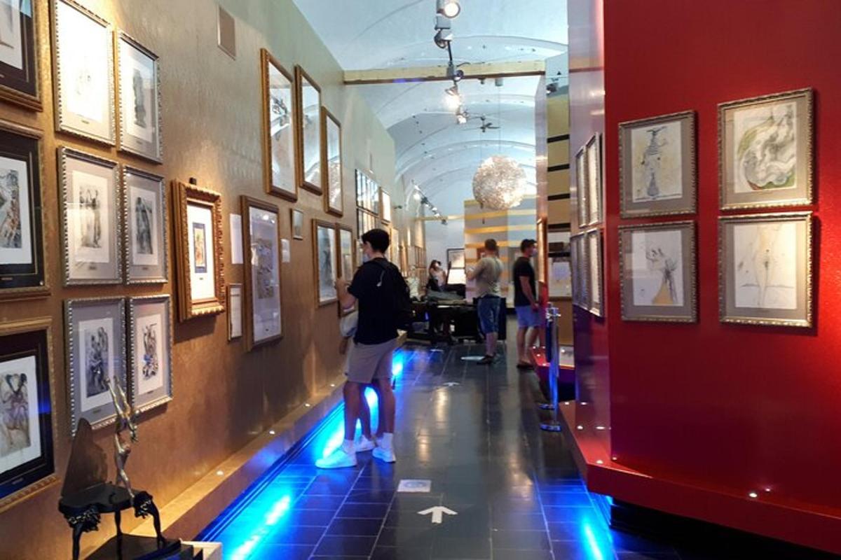 a man looking at a picture in a museum