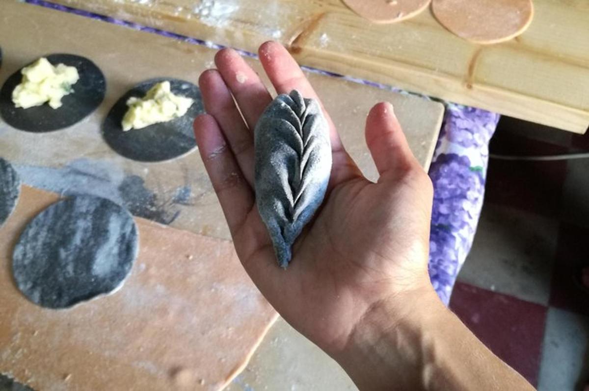 a person holding a rock in their hand