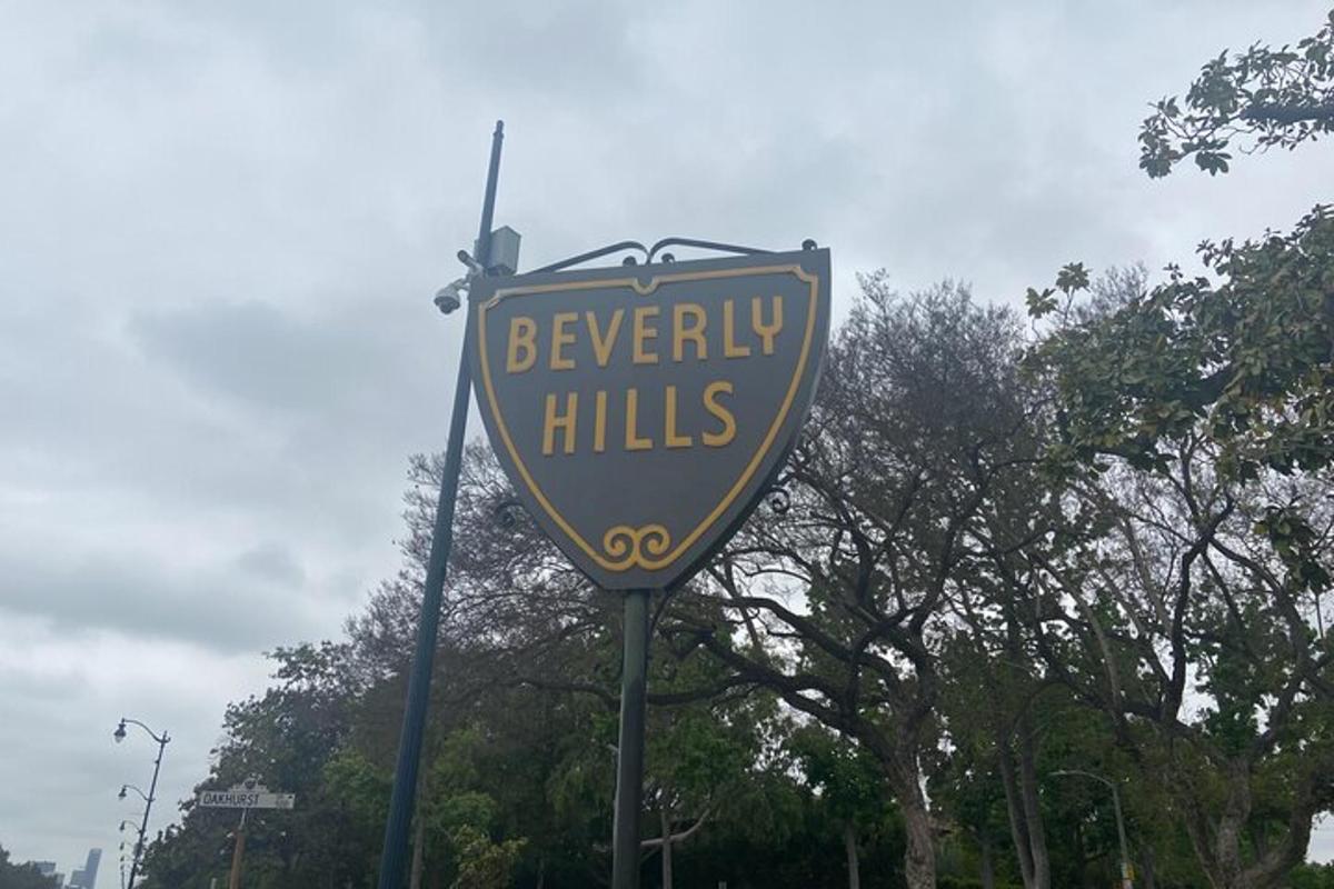 a yellow and blue sign on a street
