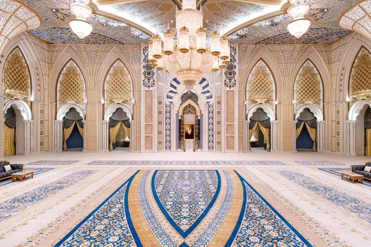 a large room with a tile floor and a chandelier