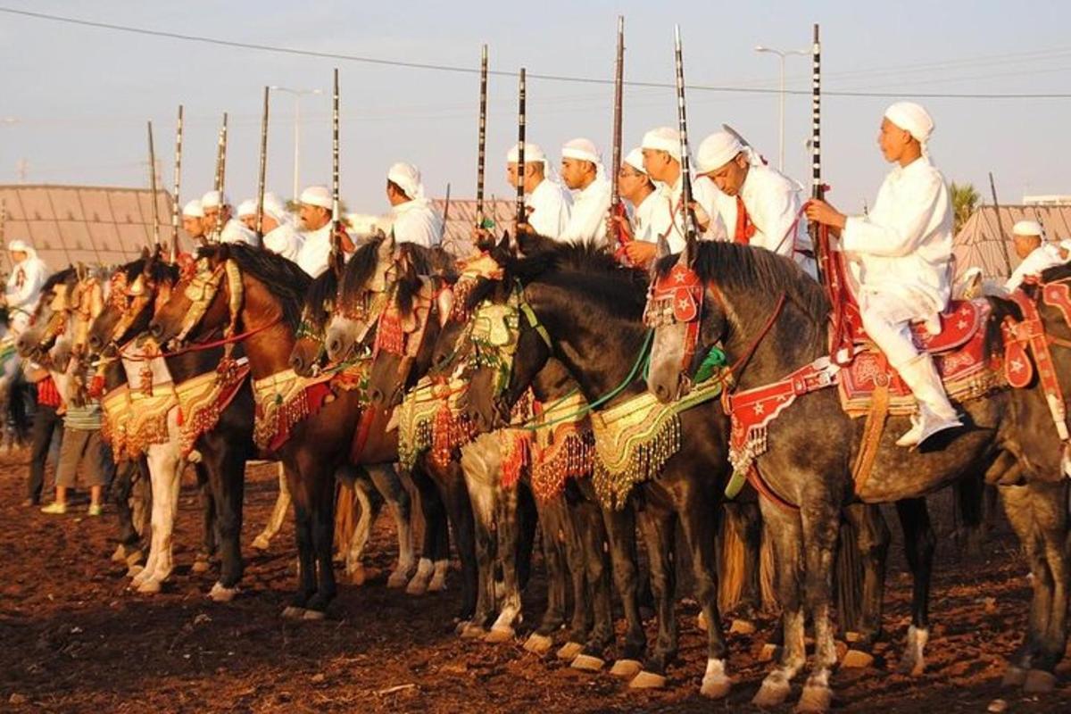 a group of men riding on horses in a line