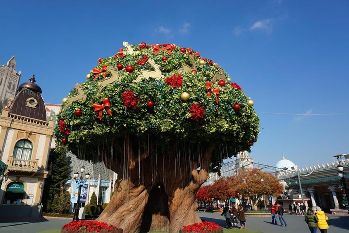 a large tree stump with areath of flowers on it