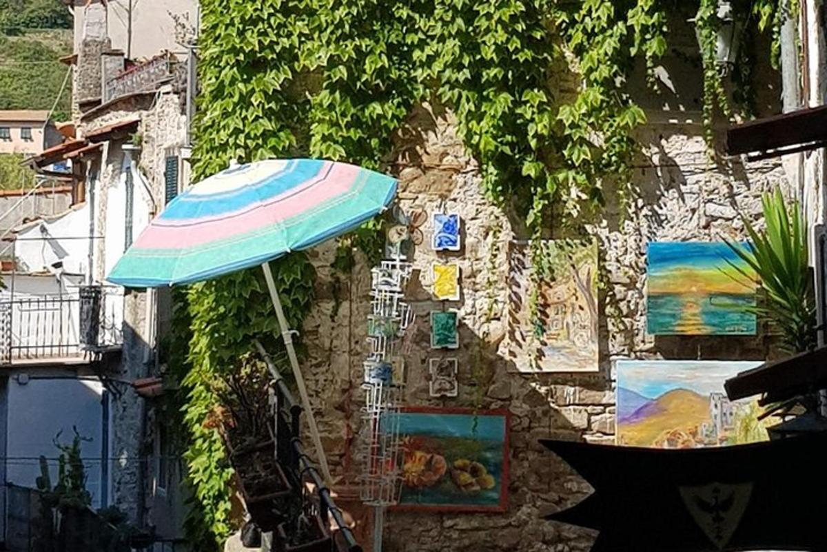 a colorful umbrella sitting on the side of a building