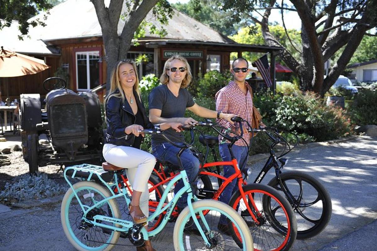 a group of three people sitting on bikes