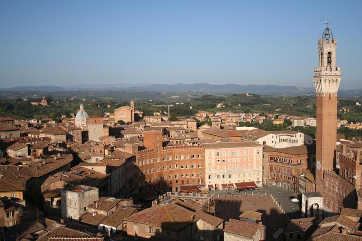 an aerial view of a city with a clock tower