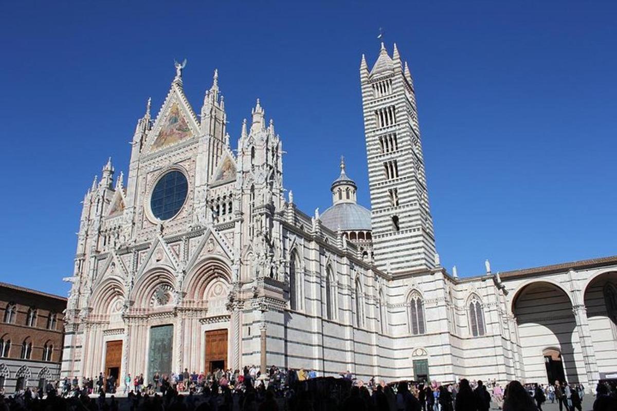 a group of people standing in front of a cathedral