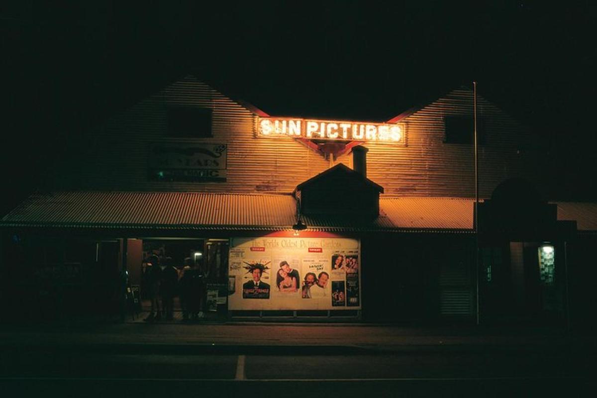 a sign on the side of a building at night