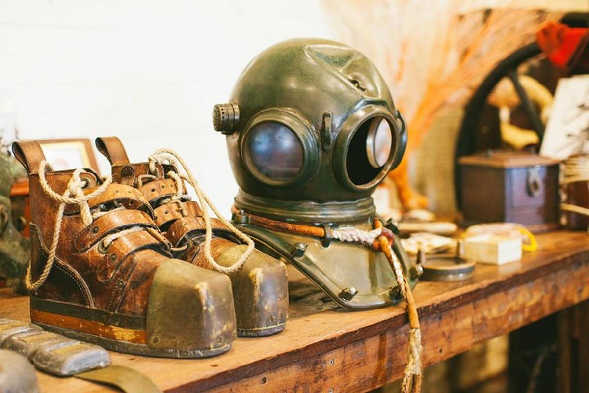 a gas mask and a pair of boots on a shelf