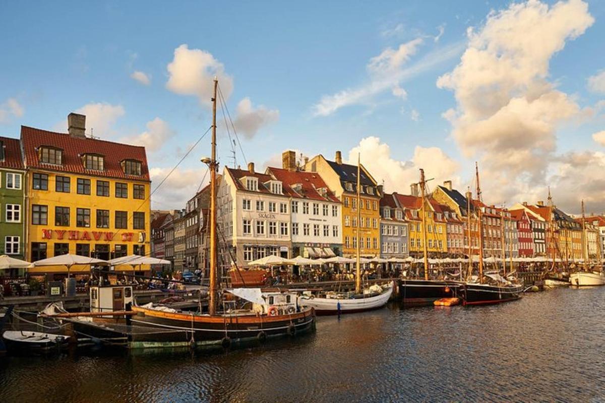 a group of boats docked in a harbor with buildings