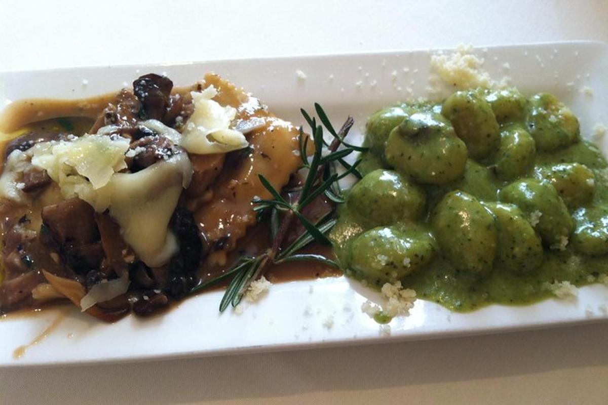 a white plate of food with potatoes and gravy