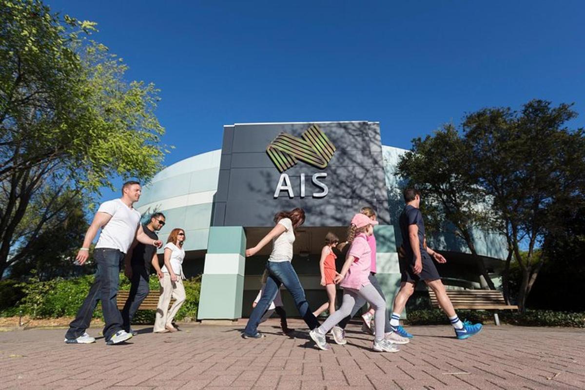 a group of people walking in front of a building