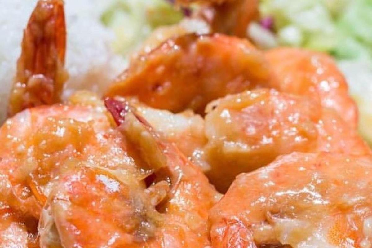 a pile of food with shrimp and broccoli