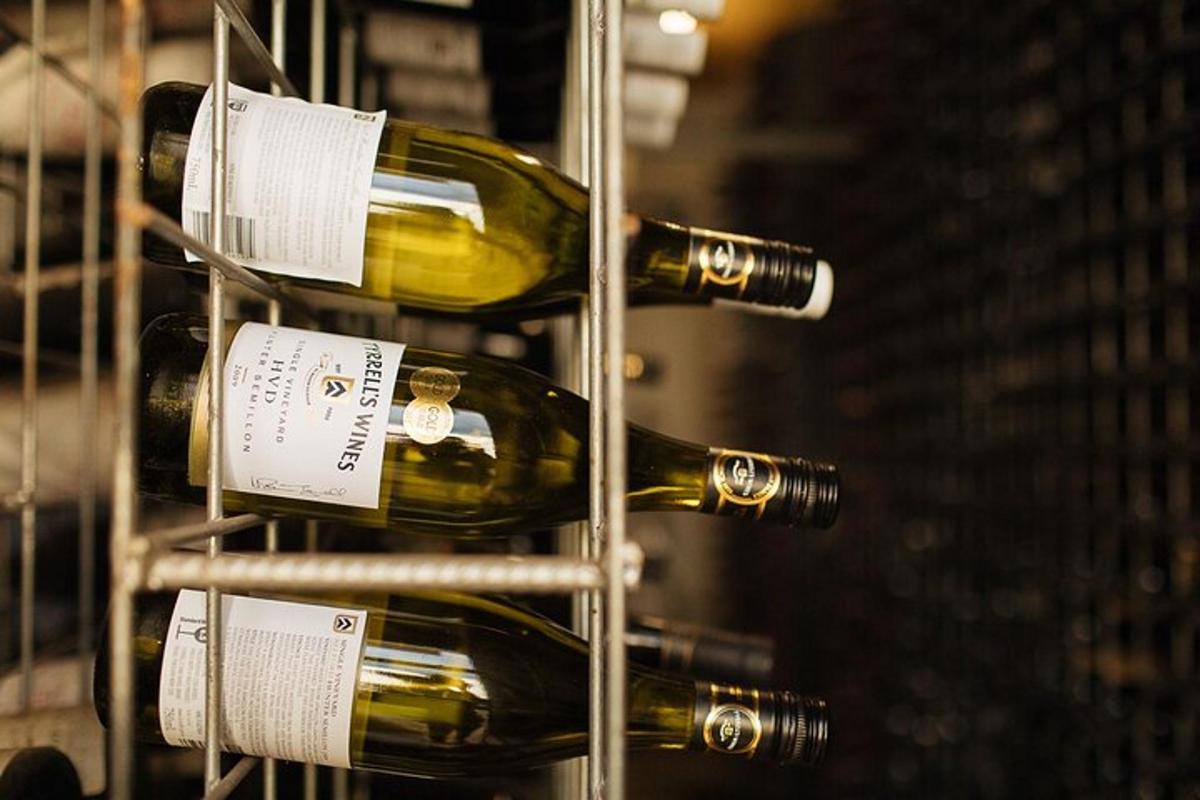 a bunch of wine bottles on a rack