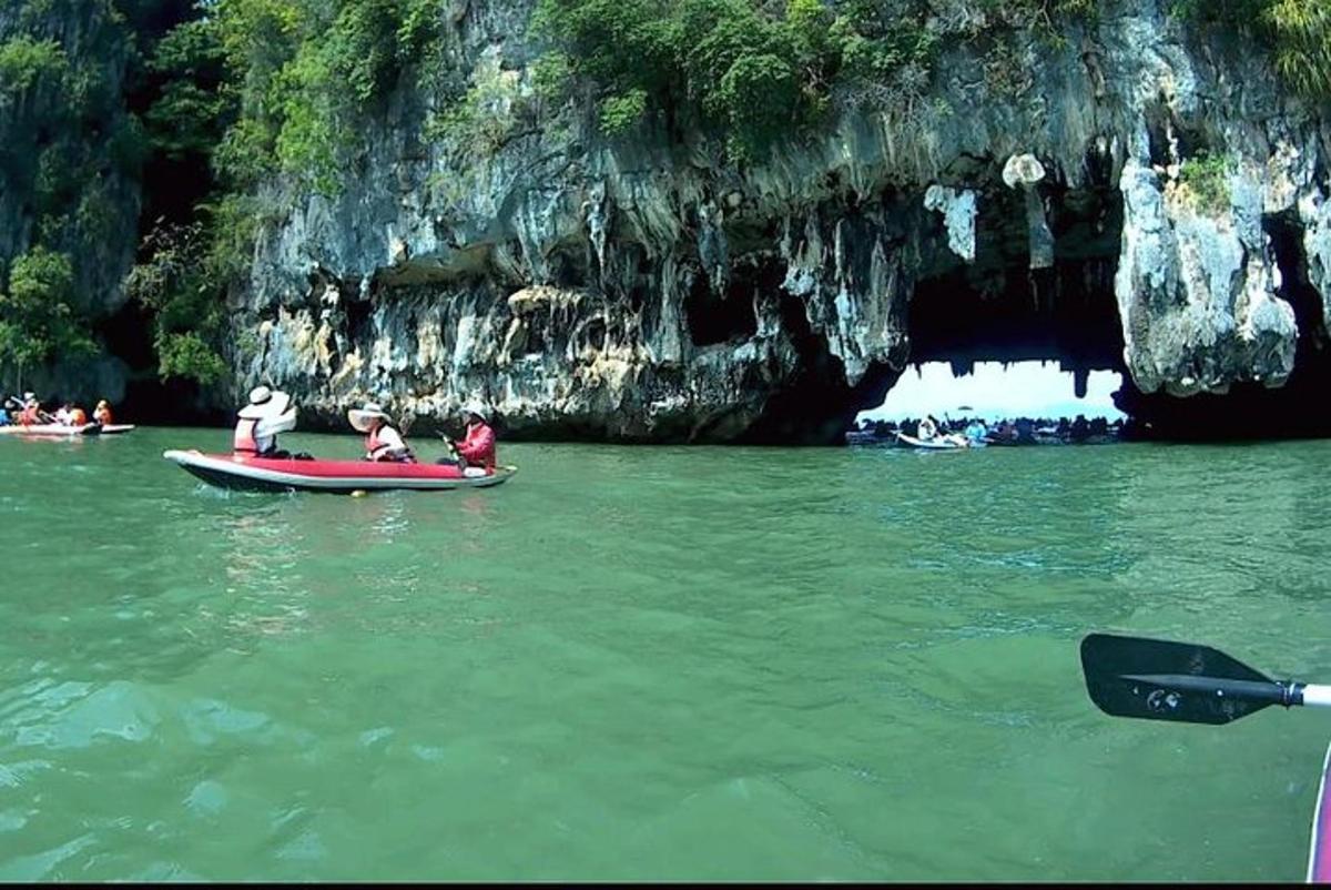 a group of people on a boat in the water