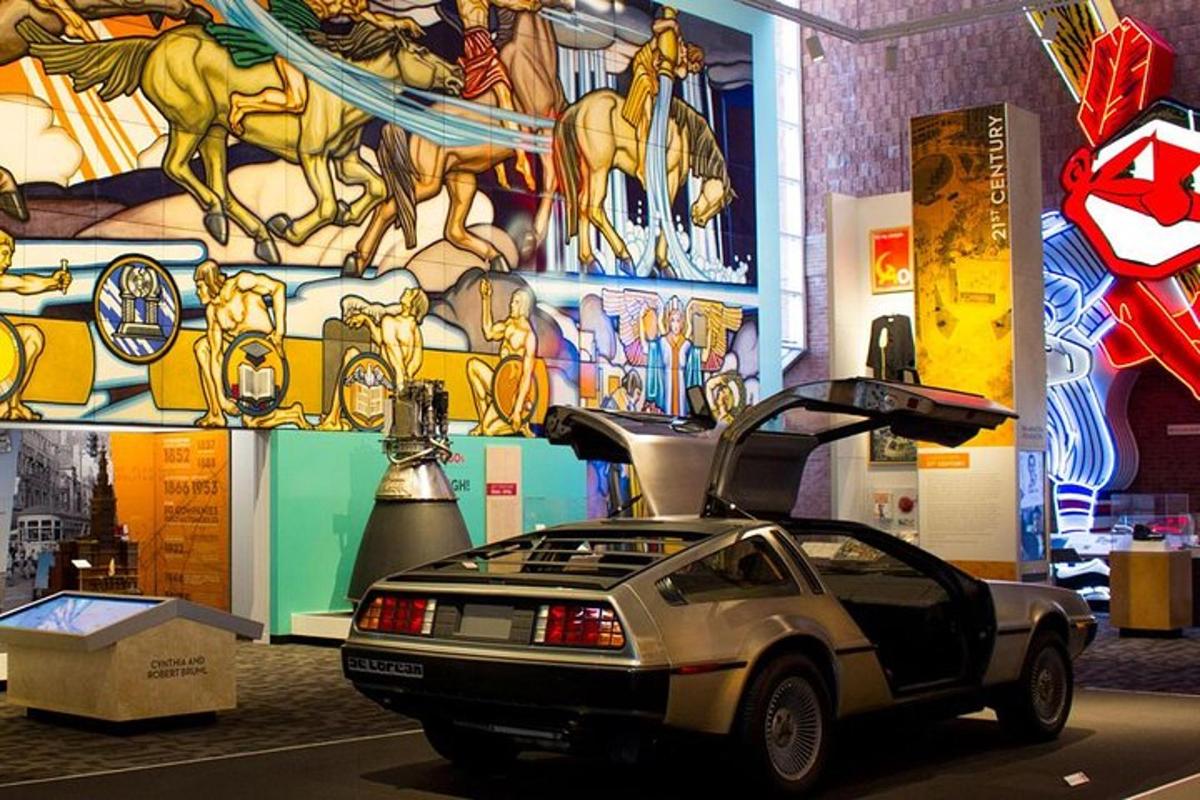 a car parked in front of a building with a mural