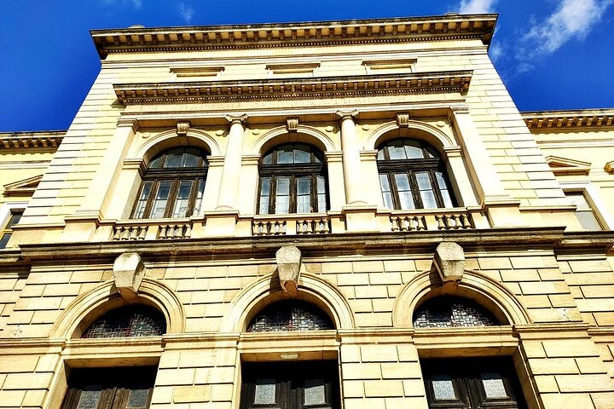 a tall building with windows on top of it