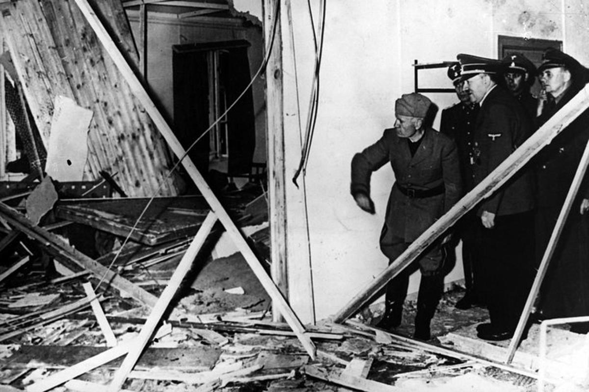 a group of men standing around a pile of rubble