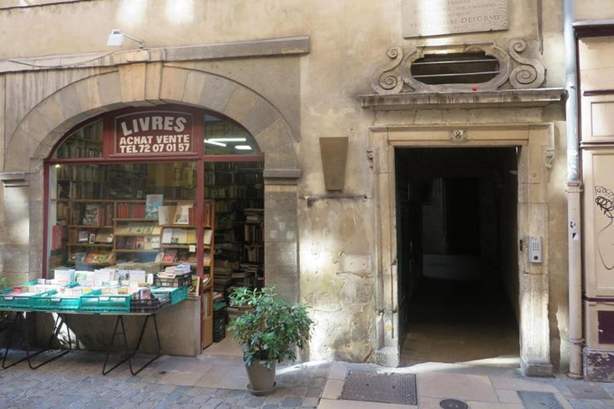 a book store with a table in front of a building