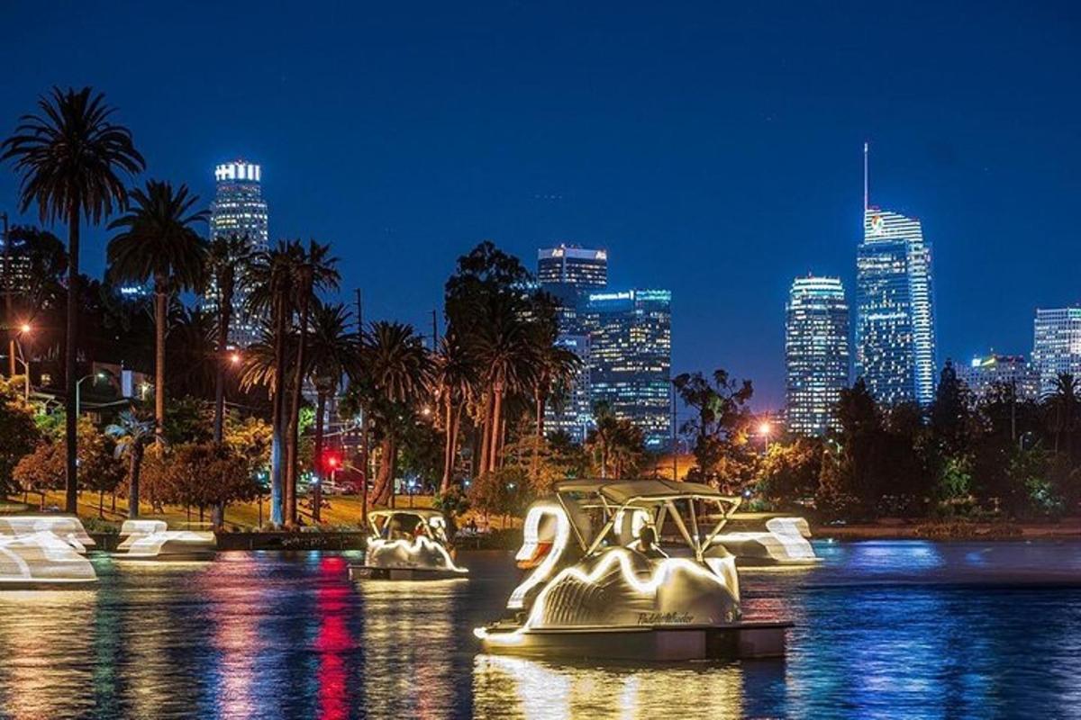 a boat in the water with a city at night