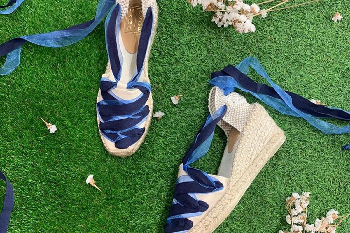 a pair of shoes sitting on the grass