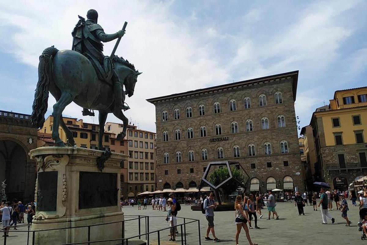 a statue of a man on a horse in a city