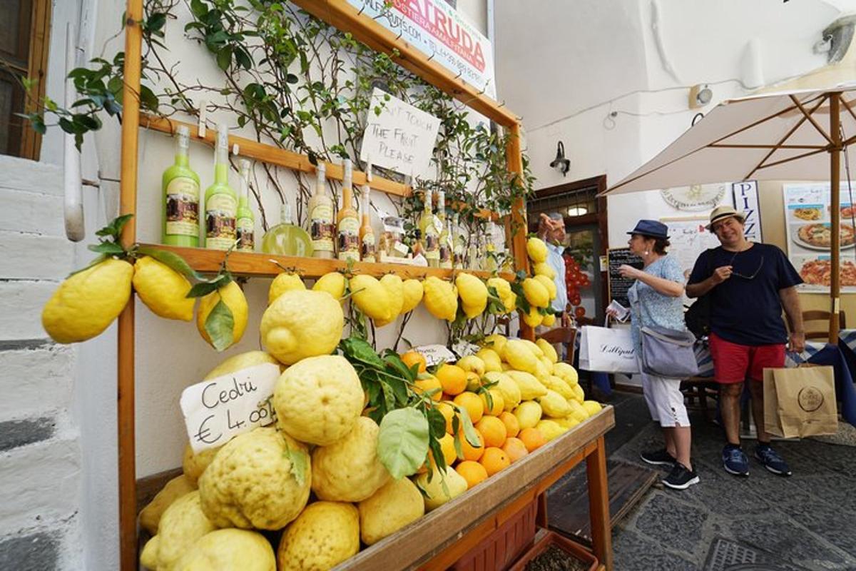 a fruit stand with a bunch of fruits and vegetables
