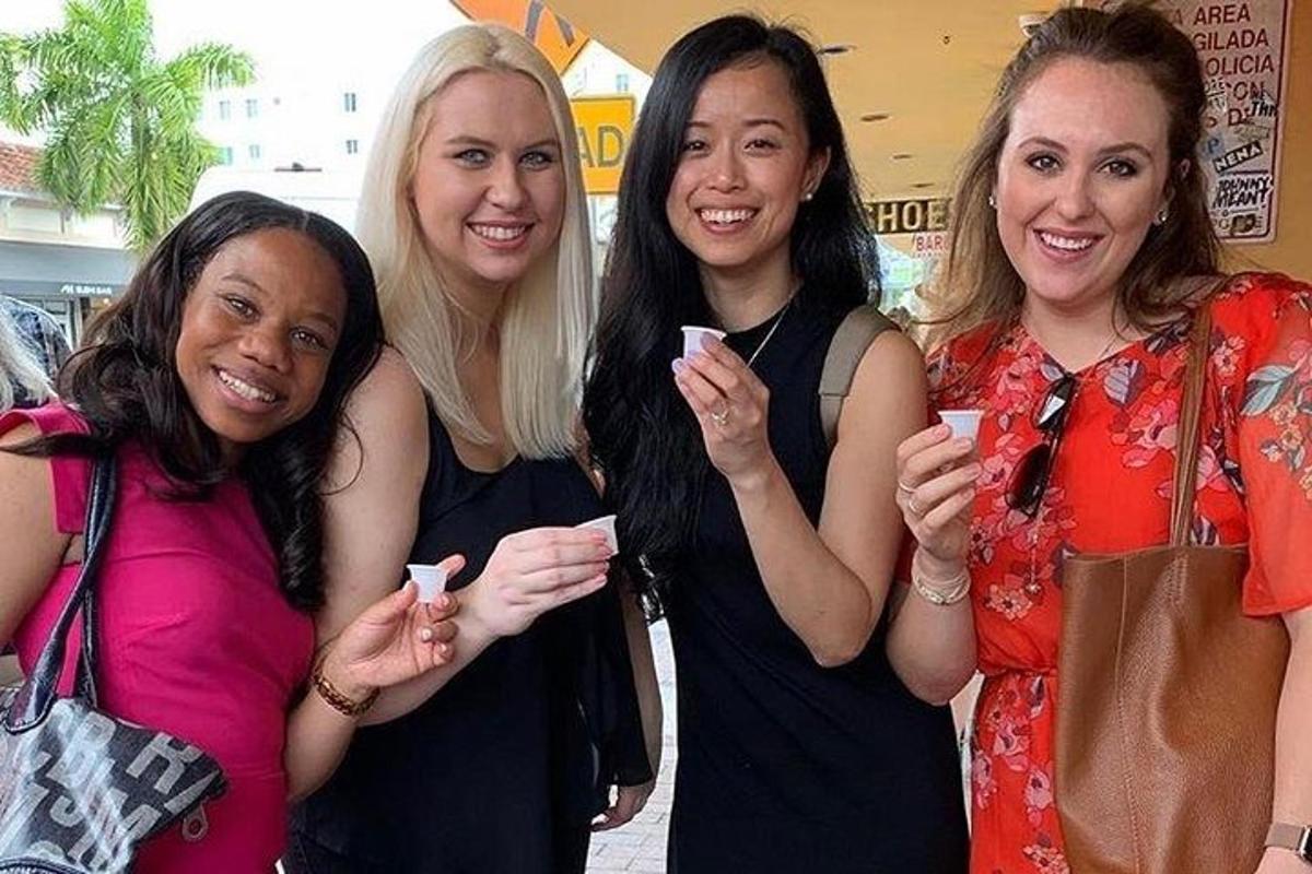 a group of four women posing for a picture