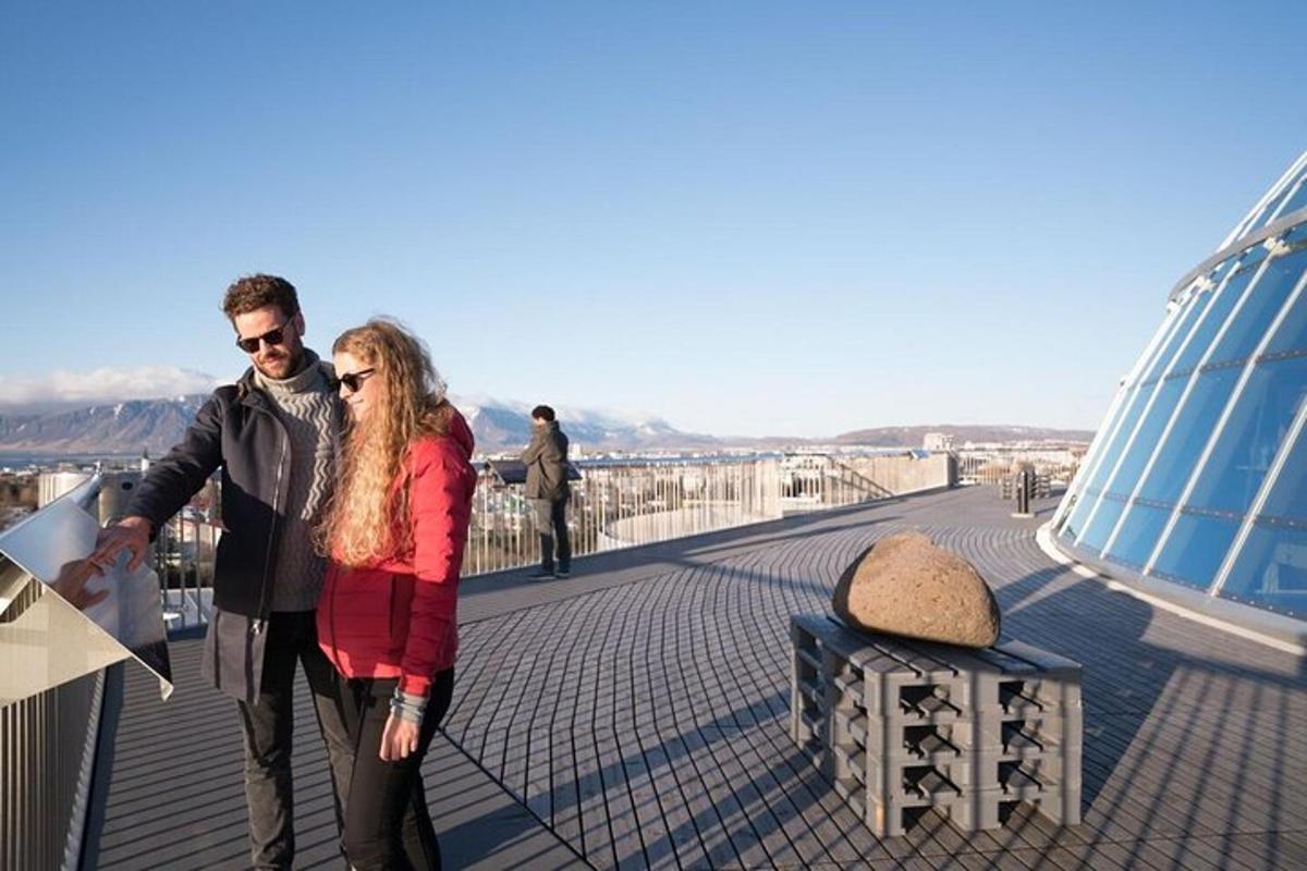 a man and a woman standing on a bridge