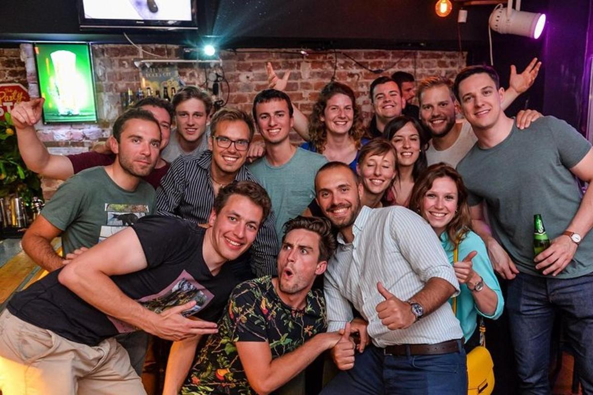 a group of people posing for a picture in a bar
