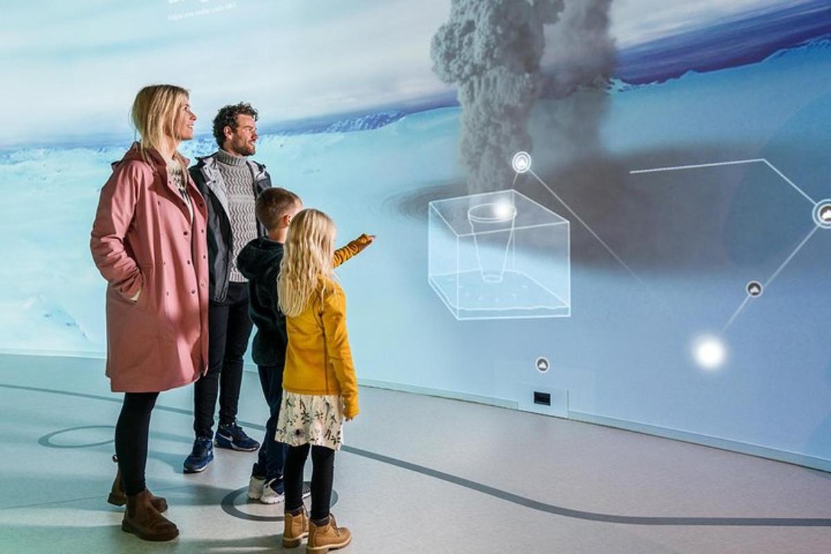a woman and a man and a child standing in front of a wall