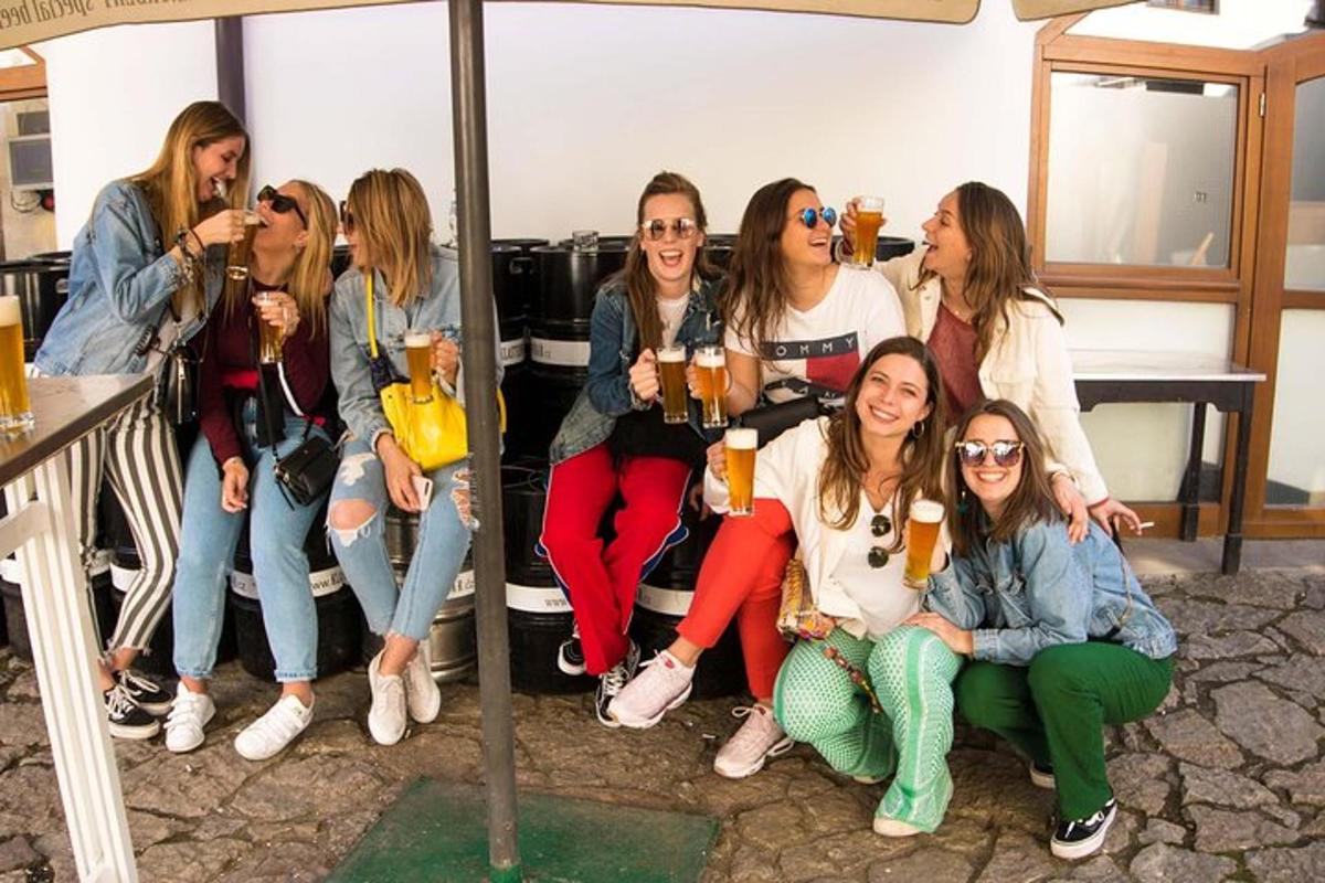 a group of women posing for a picture with drinks